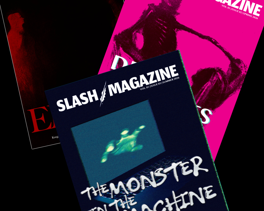 Three overlapping copies of Slash Magazine horror magazine covers arranged diagonally on a black background. The front cover is dark blue with the title 'THE MONSTER IN THE MACHINE' and a glowing green figure; the top-right cover is bright pink with a black skeletal figure; the left cover is mostly black with red imagery.
